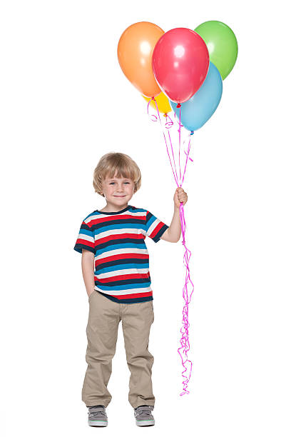 istock Happy little boy with balloons 498751055