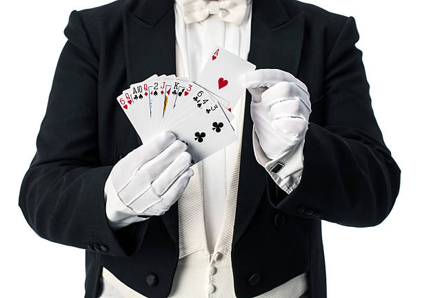 Magician card trick Magician performing trick with cards magic trick photos stock pictures, royalty-free photos & images