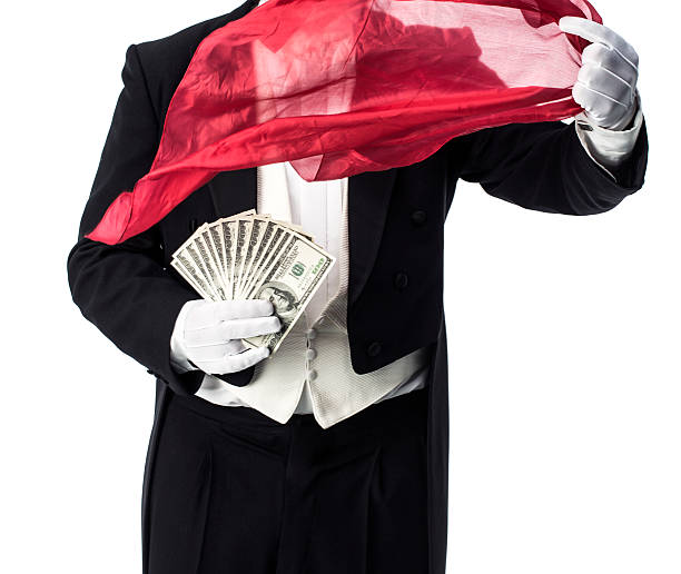 Magician trick with money Magician doing an appearance and vanish trick with money magician money stock pictures, royalty-free photos & images