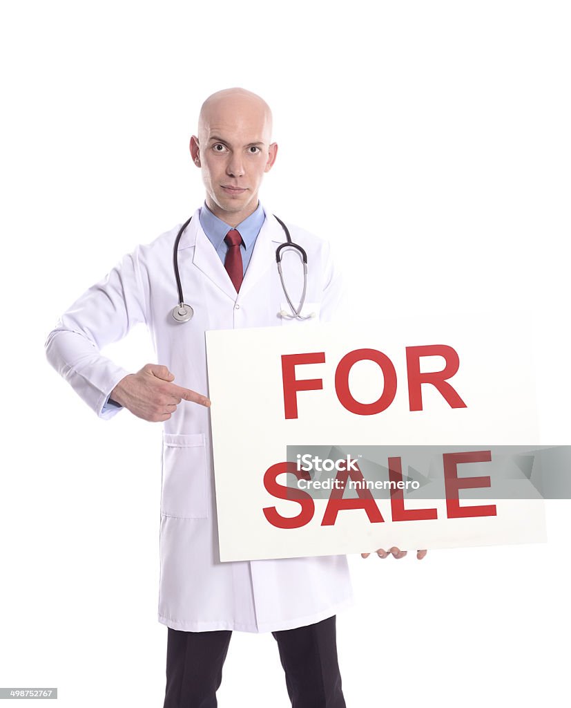 Young doctor showing blank clipboard sign Male doctor showing for sale placard isolated on white background. Adult Stock Photo