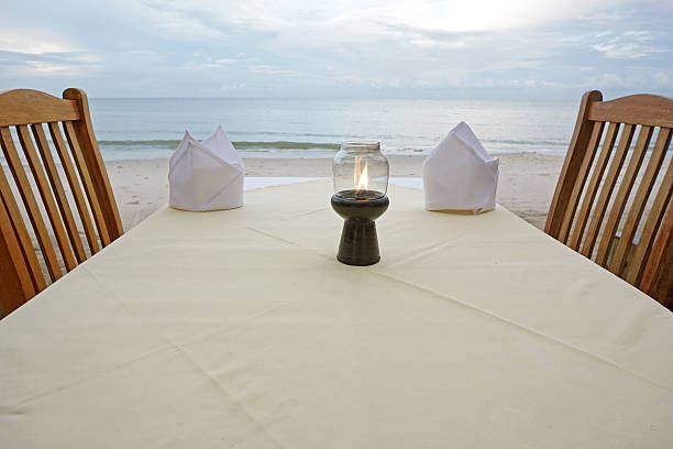 istock Table set up at a restaurant by the sea 498753237