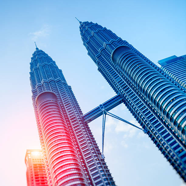 Petronas Towers, Kuala Lumpur - Malaysia. Petronas Towers at sunrise. twin towers malaysia stock pictures, royalty-free photos & images