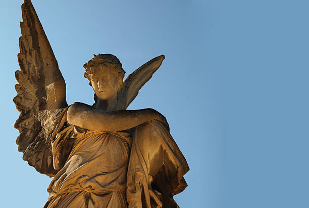 istock golden angel in the sunlight (antique statue) 498758598