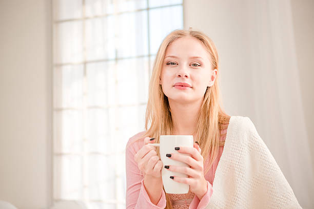 istock Beautiful woman drinking coffee in the morning 498759982