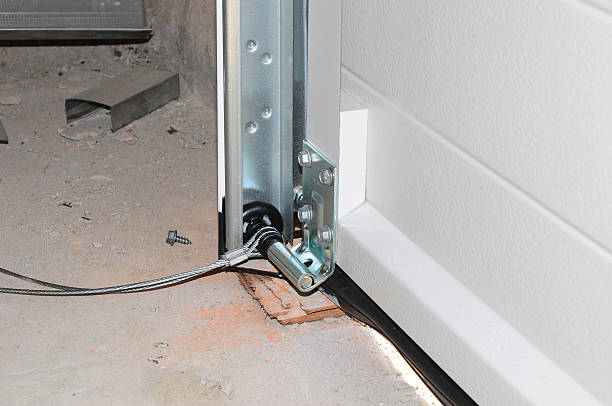 Close up on Installing Garage Door. Garage Door Post Rail