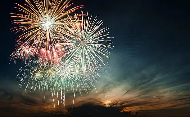 Photo of Brightly colorful fireworks in the night sky