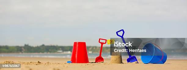 Beach Sea With Buckets Spades Sandcastles And Welsh Flag Stock Photo - Download Image Now