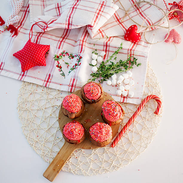 istock New Year celebration cupcakes, chocolate muffins on table. Top view 498765612