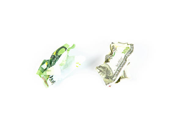 istock Crumpled hundred dollar and euro bills 498766082