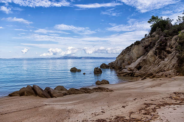 istock Rocks and sand in a beautiful beach in Chalkidiki, Greece 498766117