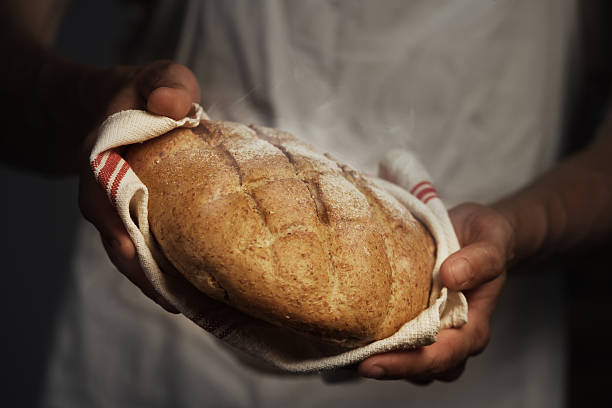 Baker man Baker man holding a warm bread baking bread photos stock pictures, royalty-free photos & images