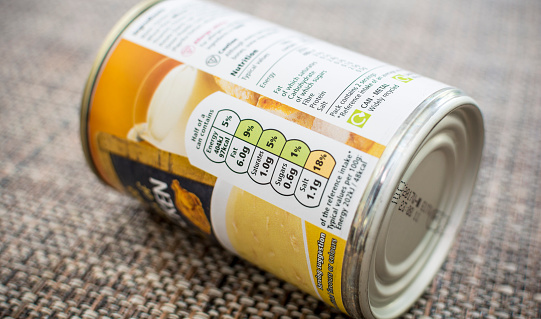 Poole, UK - November 26, 2015: A tin of Tesco soup on its side with the nutrional information the main focus. This type of label appears on the majority of food products sold. 