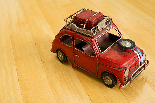 istock Old red toy car on a wooden floor. 498769495