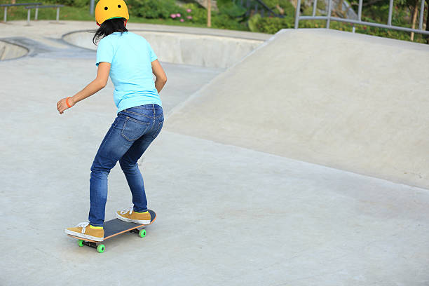 istock skateboarding woman at skatepark 498770234