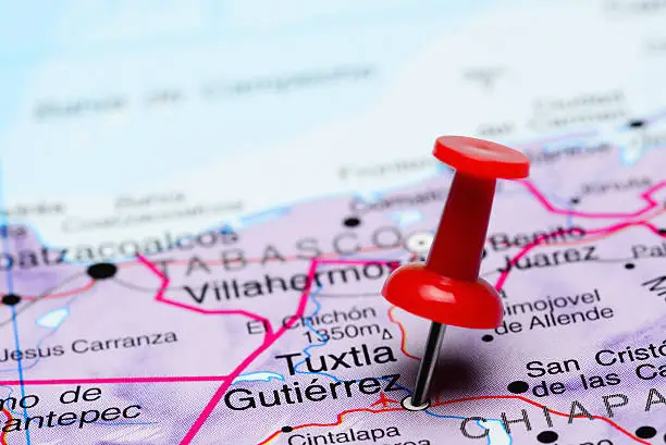 Photo of pinned Tuxtla Gutierrez on a map of Mexico. May be used as illustration for traveling theme.