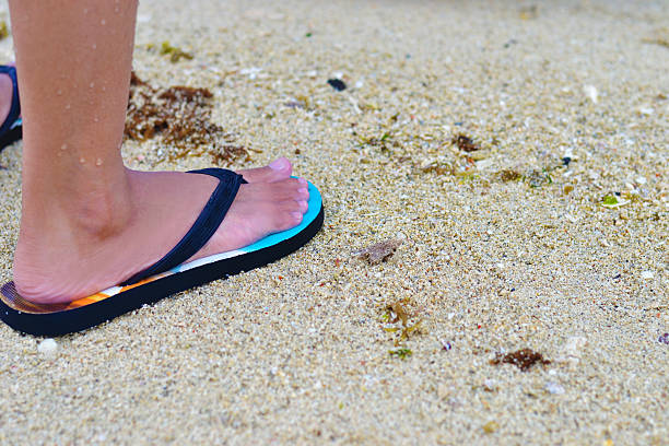 夏の足 - flip flop human foot sand women ストックフォトと画像
