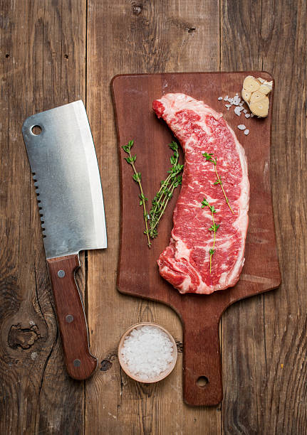 istock Raw beef meat Ribeye Steak with herbs and spices 498770624