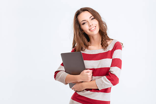 istock Happy cute woman holding laptop computer 498770650