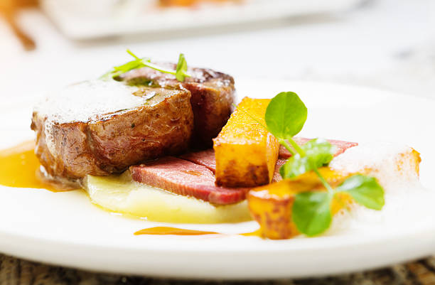 istock Grilled filet mignon garnished with gourmet sauces and vegetables 498770674