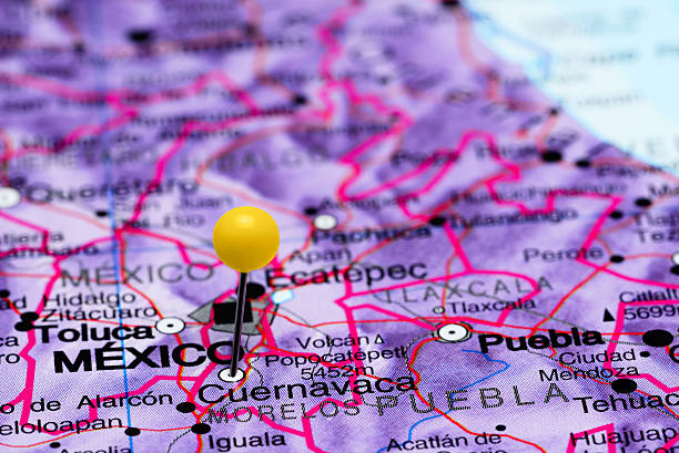 Cuernavaca pinned on a map of Mexico Photo of pinned Cuernavaca on a map of Mexico. May be used as illustration for traveling theme. cuernavaca stock pictures, royalty-free photos & images