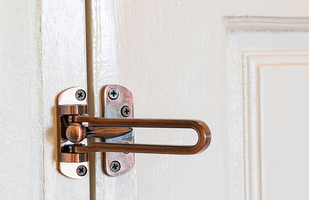 istock modern style door handle on wooden door 498770994