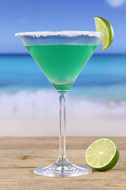 istock Green Martini Cocktail on the beach 498771227