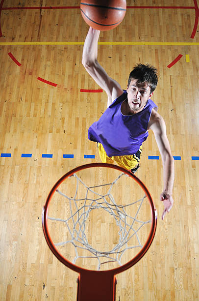 istock basket ball game player at sport hall 498771535