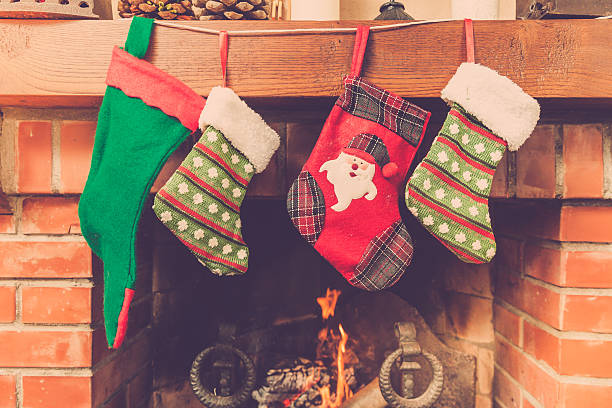 istock Christmas stockings hanging above a fireplace 498773206