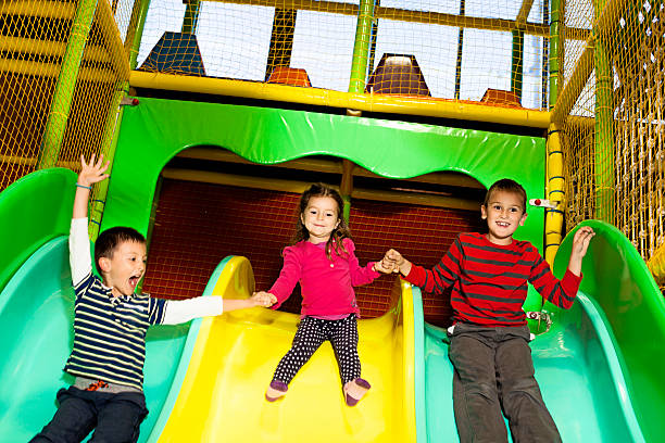 istock Children on slide at indoor playground 498773404