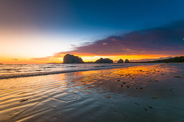 istock Beautiful tropical sand beach against the sunset  sky. 498773430