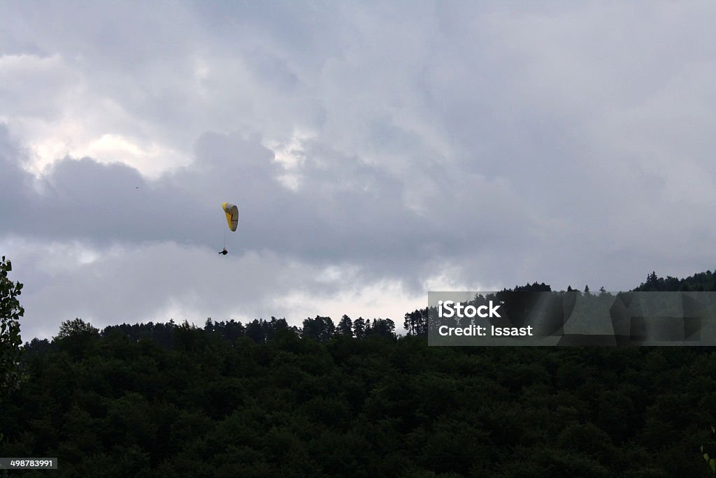 Paragliding near Piatra Mare Peak This is a paraglider near Piatra Mare peak. Mountain Stock Photo