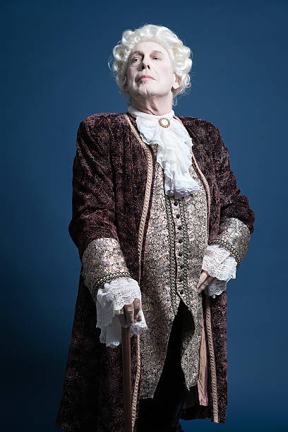 istock Retro baroque man with white wig standing with walking stick. 498785549