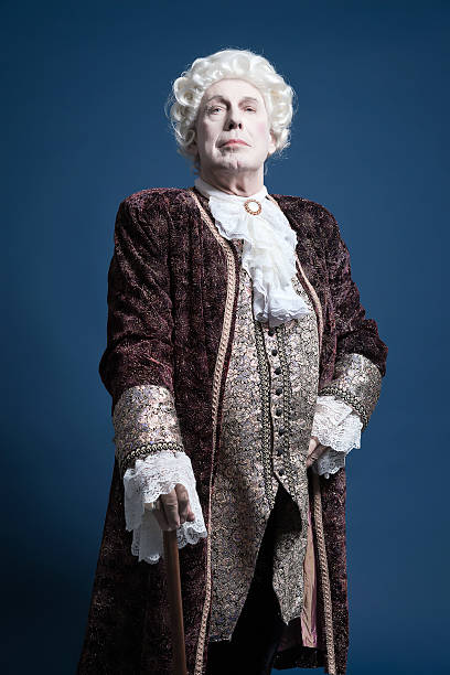 istock Retro baroque man with white wig standing with walking stick. 498785555