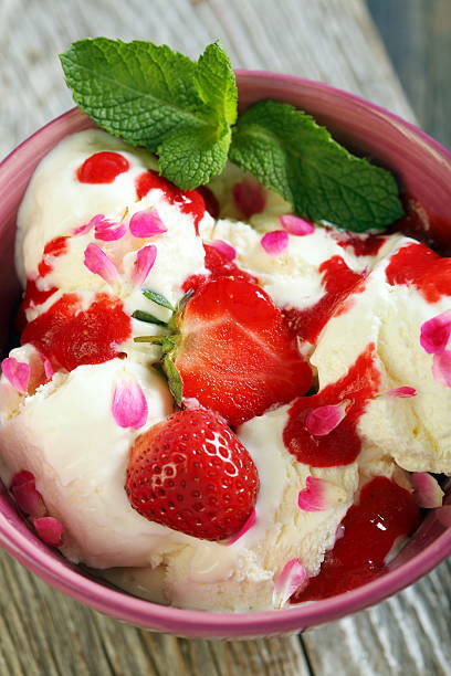 istock Ice cream with strawberries and rose petals. 498789463