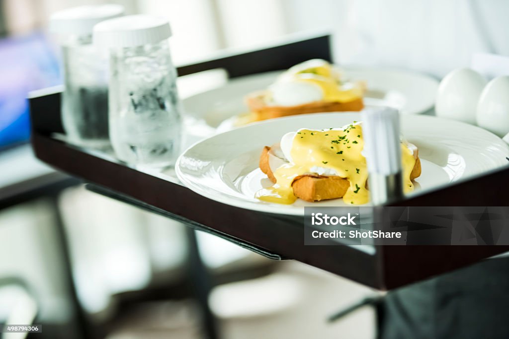Food on tray Room service, unrecognizable person is holding a tray with food, selective focus  Food Stock Photo