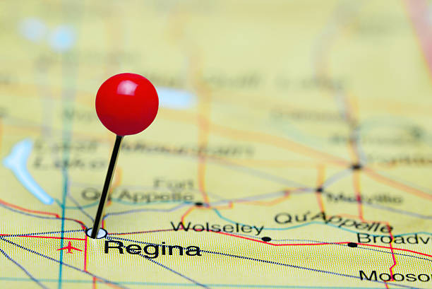 Regina pinned on a map of Canada Photo of pinned Regina on a map of Canada. May be used as illustration for traveling theme. regina stock pictures, royalty-free photos & images