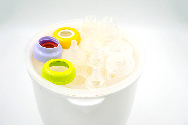istock Steaming and sterilizing milk bottles for baby 498797200