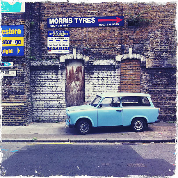 London, United Kingdom - July 27, 2011: Old car parked along the sidewalk in the periphery of the city