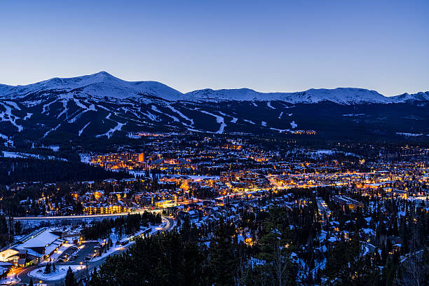 Breckenridge Colorado Winter Dusk Ski Runs - Landscape scenic at dusk during blur  hour showing ski resort runs and town of Breckenridge lit up in winter.  Breckenridge, Colorado USA.