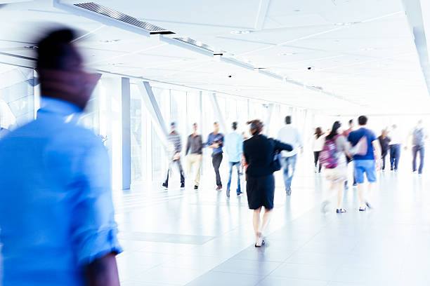 istock Motion Blur of People Walking in Corridor 498799184