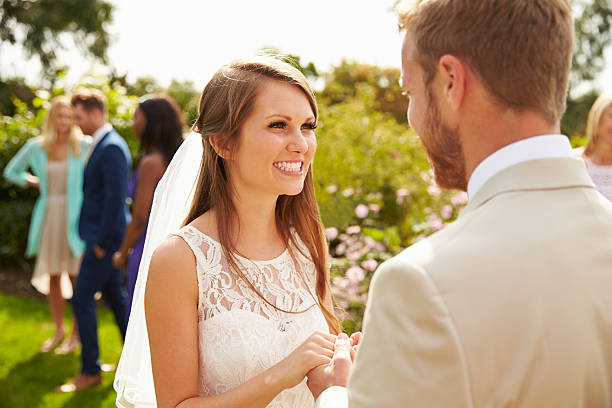 istock Romantic Young Couple Getting Married Outdoors 498799640