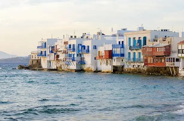 Little venice, aka Lefkandra, mikri Venetia a landmark of Chora in greek island Mykonos, Greece. Picturesque coffee shops and restaurants overlooking the aegean with colourful balconies hanging over the blue sea.