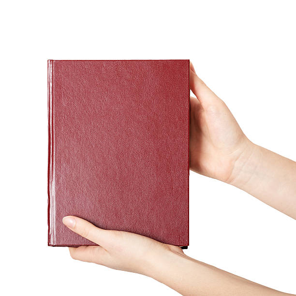 istock woman hands holding red book 498799808