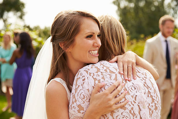 istock Bride Hugging Mother On Wedding Day 498799872