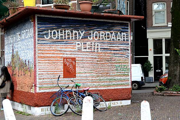 Amsterdam, The Netherlands - July 14, 2015: Decorated kiosk on the Johnny Jordaanplein in Amsterdam. This is a small square dedicated to famous Amsterdam singers like Johnny Jordaan himself, Tante Leen, Johnny Meyer, Manke Nelis and Jan & Mien. Locally they're also called the pearls of the Jordaan. The square is located on the corner of the Elandsgracht and the Prinsengracht near the Berensluis in the Jordaan district.