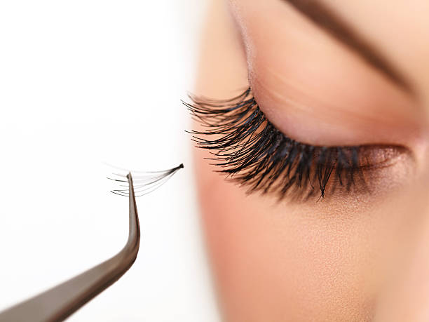 Woman eye with long eyelashes. Eyelash extension stock photo