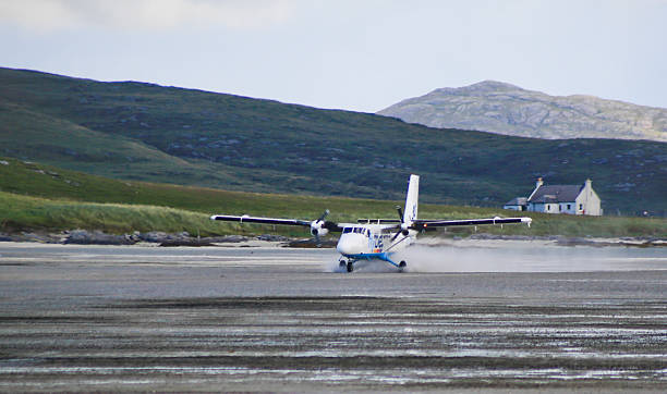 Airplane Landing at the Barra Airport stock photo