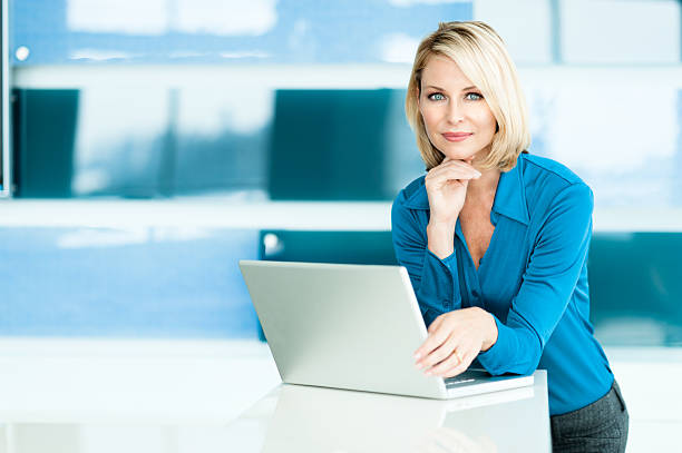 istock Blonde Woman in Modern Home Office 498802998