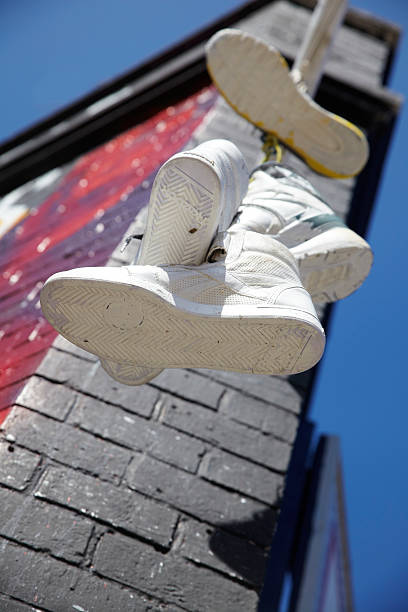 istock trainers hanging to mark turf 498804422