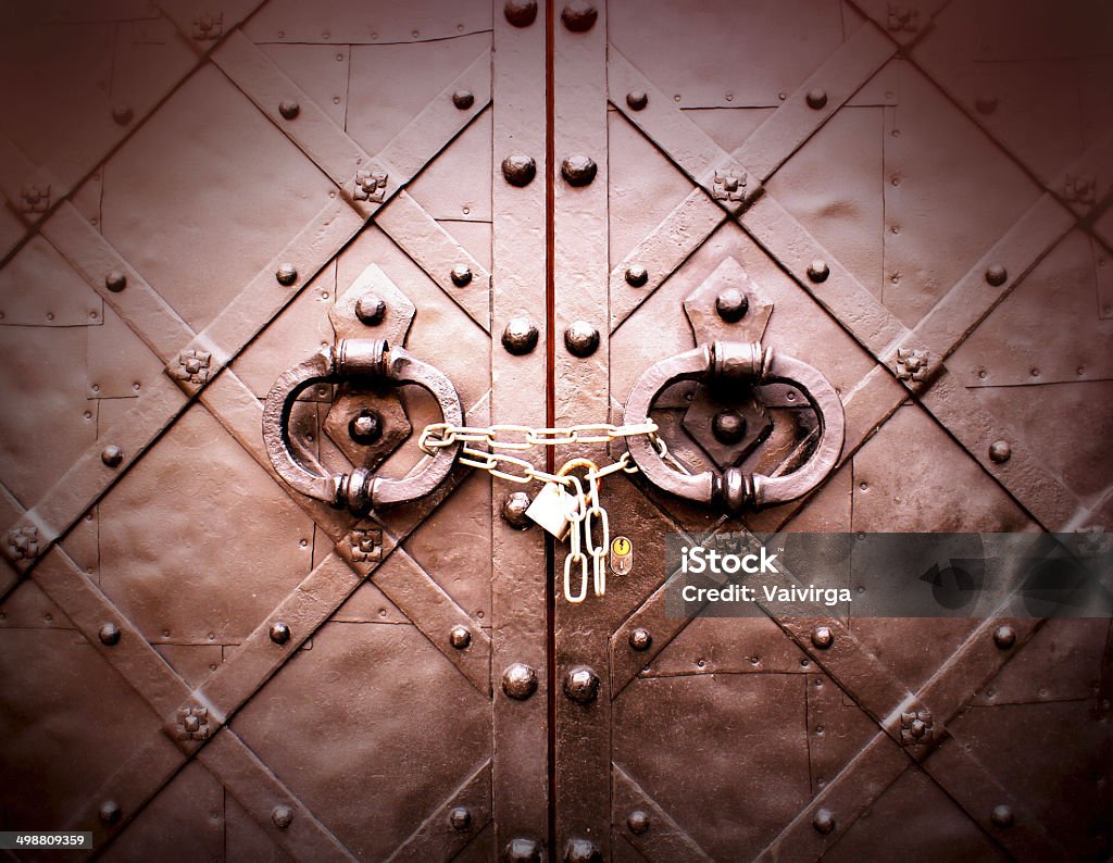 Old door with metal handle and circuit Accessibility Stock Photo
